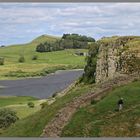 walkers beside crag lough Hadrians Wall