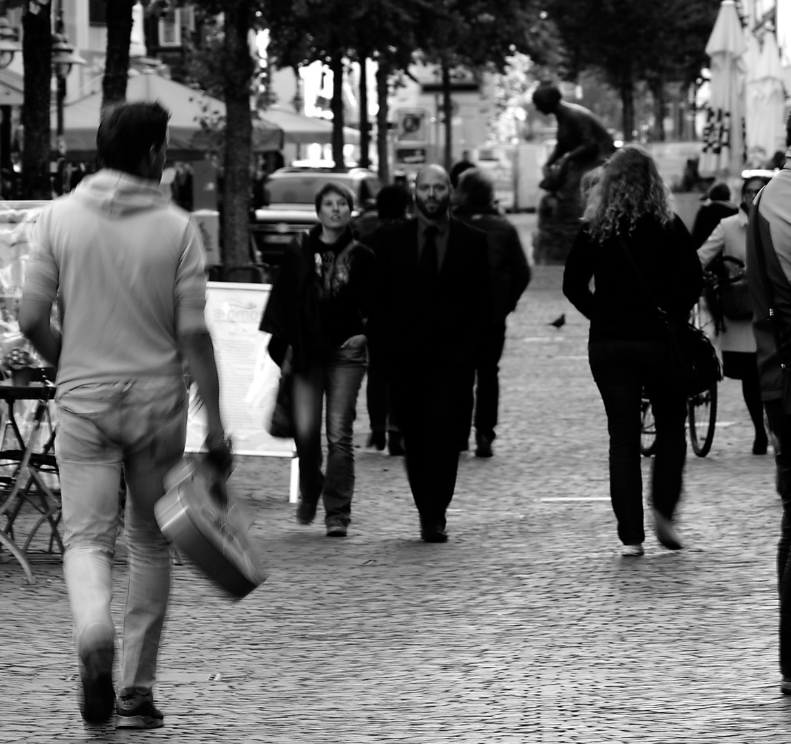 Walking man with guitar