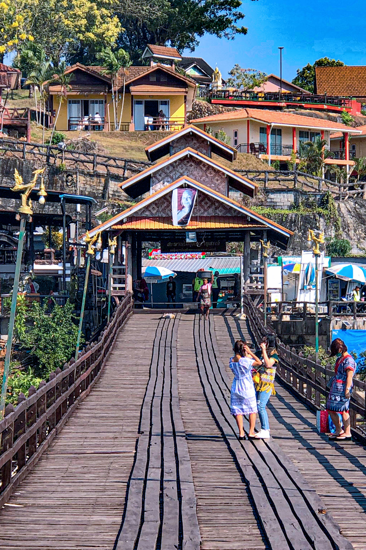 Walking over Uttamanusorn Bridge