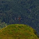 Wanderer bei der Rast am Kreuz