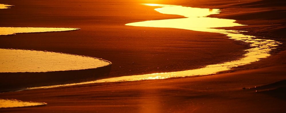 Wasserlachen am Strand