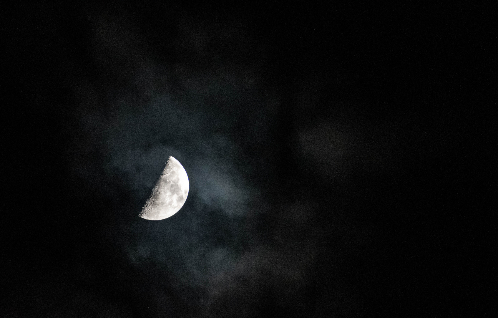 Watching the moon in a rainy night