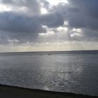 Watt an der Nordsee unter dicken Wolken