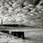 Wattewolken und ein Leuchtturm