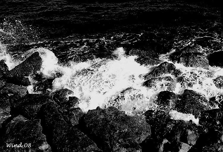 Waves burst in the rocks