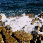 Waves burst in the rocks