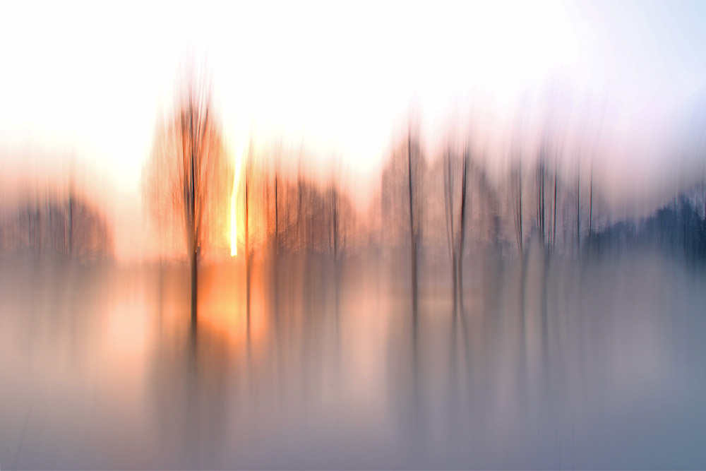 Weiher mit Wischeffekt bei untergehender Sonne