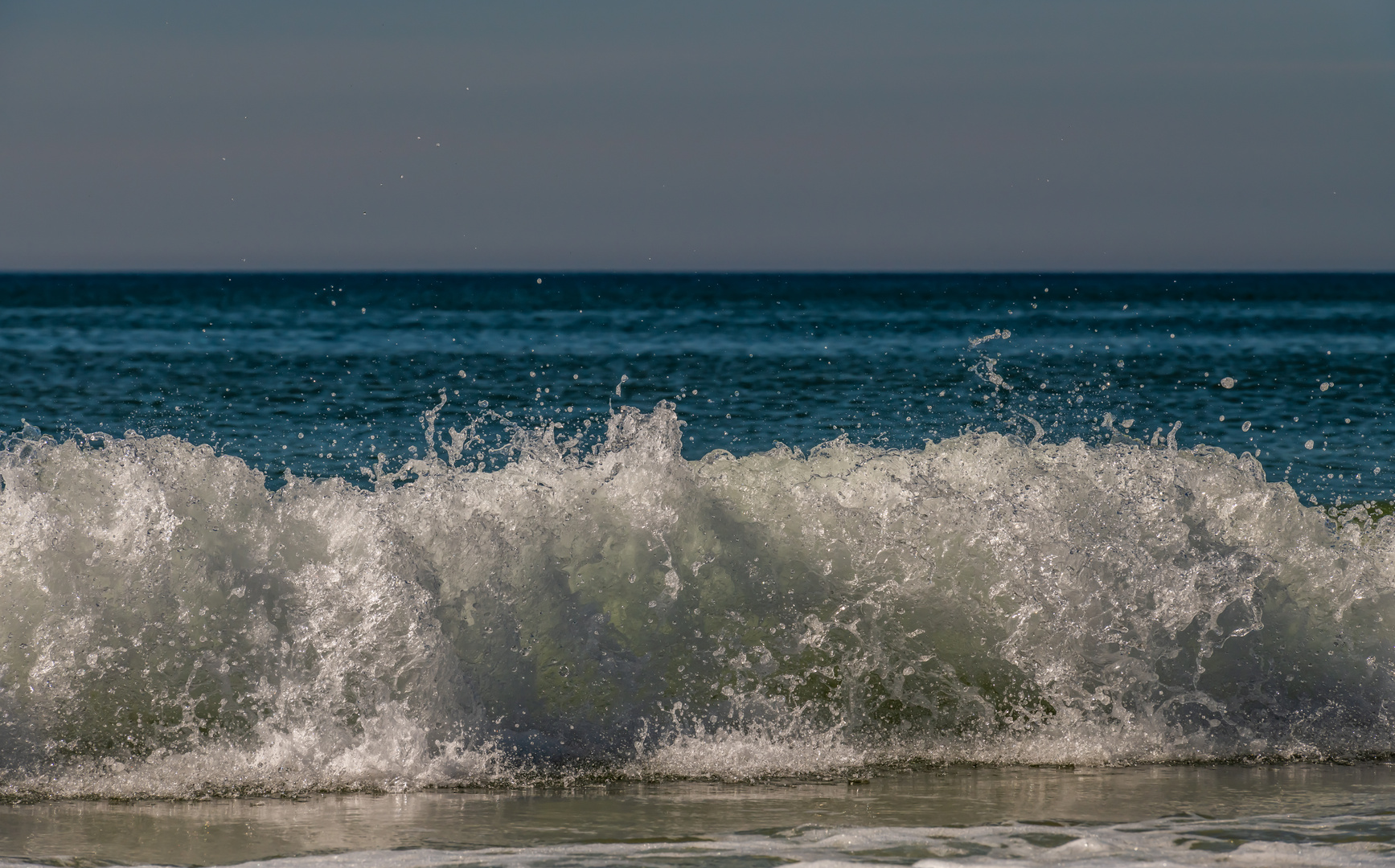 Welle am Strand