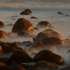 Wet rocks and a smooth sea