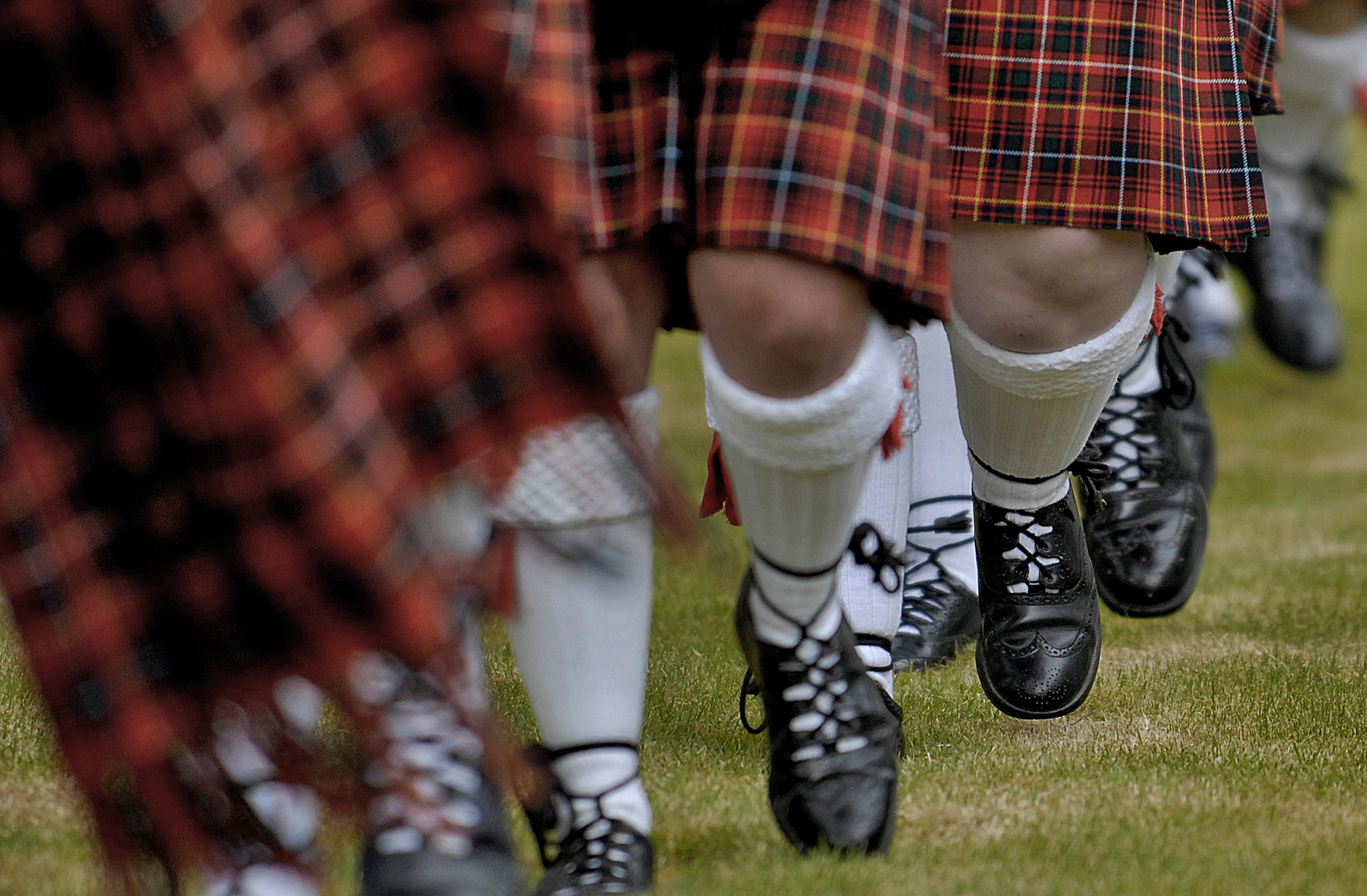 Why do bagpipers walk when they play ?