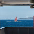 Windkraft grüßt den alten Leuchtturm