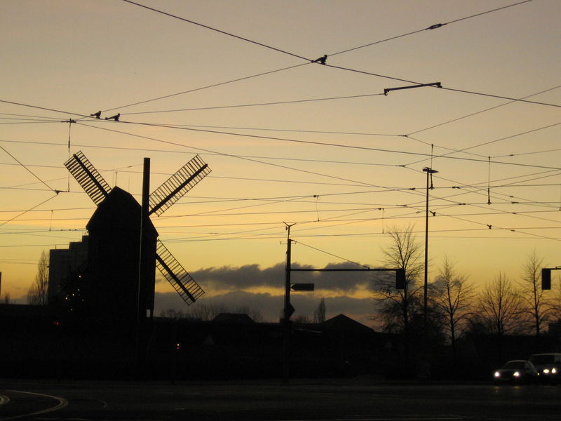 windmill watches the sunset