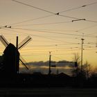 windmill watches the sunset