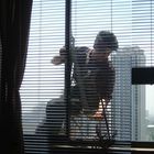 WINDOW CLEANER IN MY HOTEL ROOM ON THE 22 ND FLOOR.