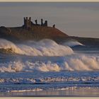 winter waves dunstanburgh castle