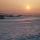 Winterlandschaft mit Sonnenuntergang