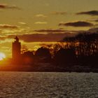 Winterlicher Sonnenuntergang am Leuchtturm