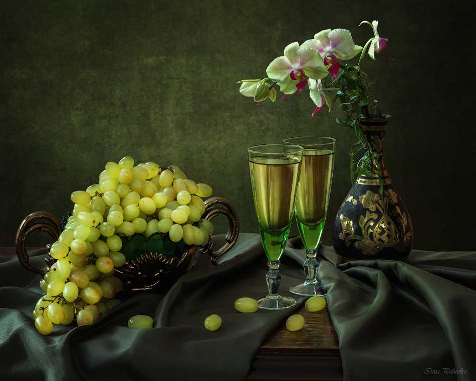 With grapes and orchid