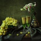 With grapes and orchid