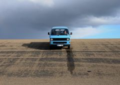 with his vw bus on dike