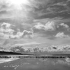 Wolken, Sandbank und Spiegelungen