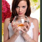 Woman Holding Fishbowl With Goldfish