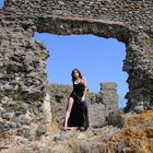 woman in black among the ruins