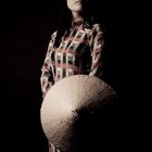 Woman in traditional Ao Dai and straw hat