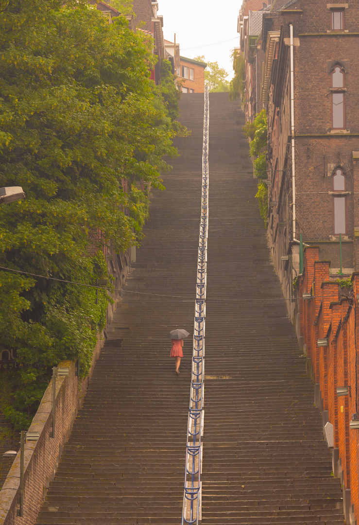 woman on stairs with umbrella