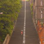 woman on stairs with umbrella