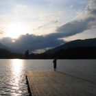 Woman standing at a lake in Tyrol