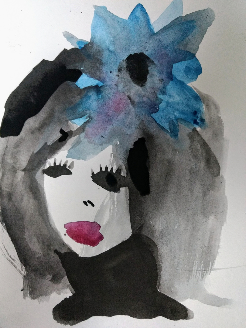 Woman with blue flower in her hair