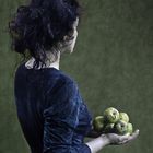 Woman with green apples