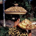 Woman with Peanuts and Fruits.