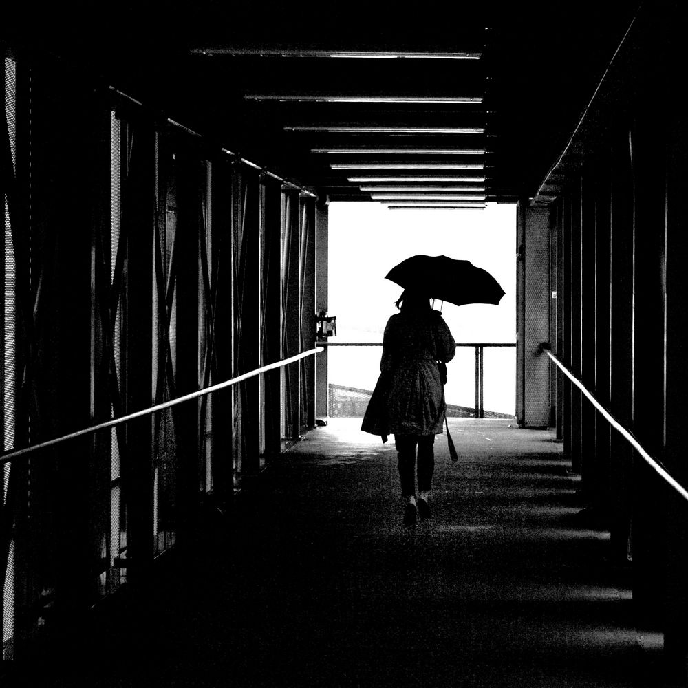 Woman with umbrella by JAN ERIK FILLAN photography 