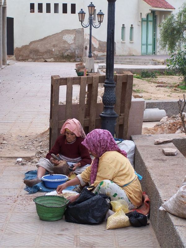 Women Breaking Argan Nuts