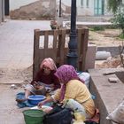 Women Breaking Argan Nuts