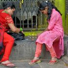 Women give their donation lamps