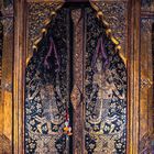 Wooden door to Thung Si Muang