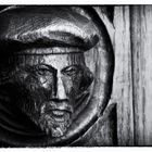 Wooden head on bureau