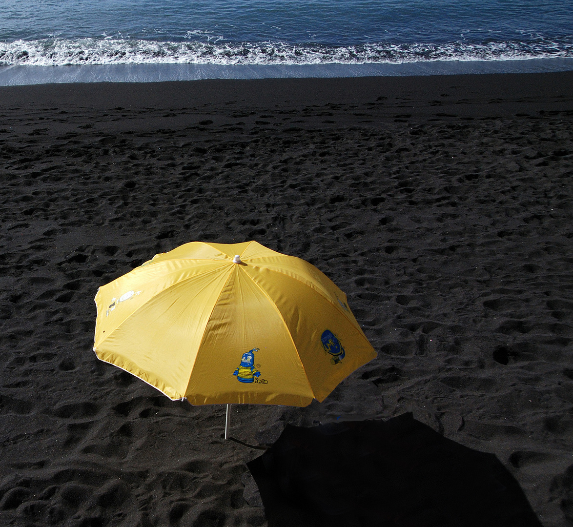 yellow on black beach