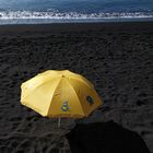 yellow on black beach