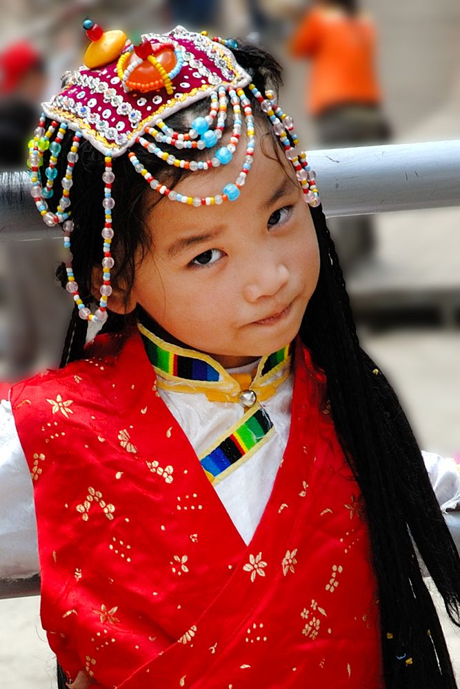 Yi girl in her traditional outfit