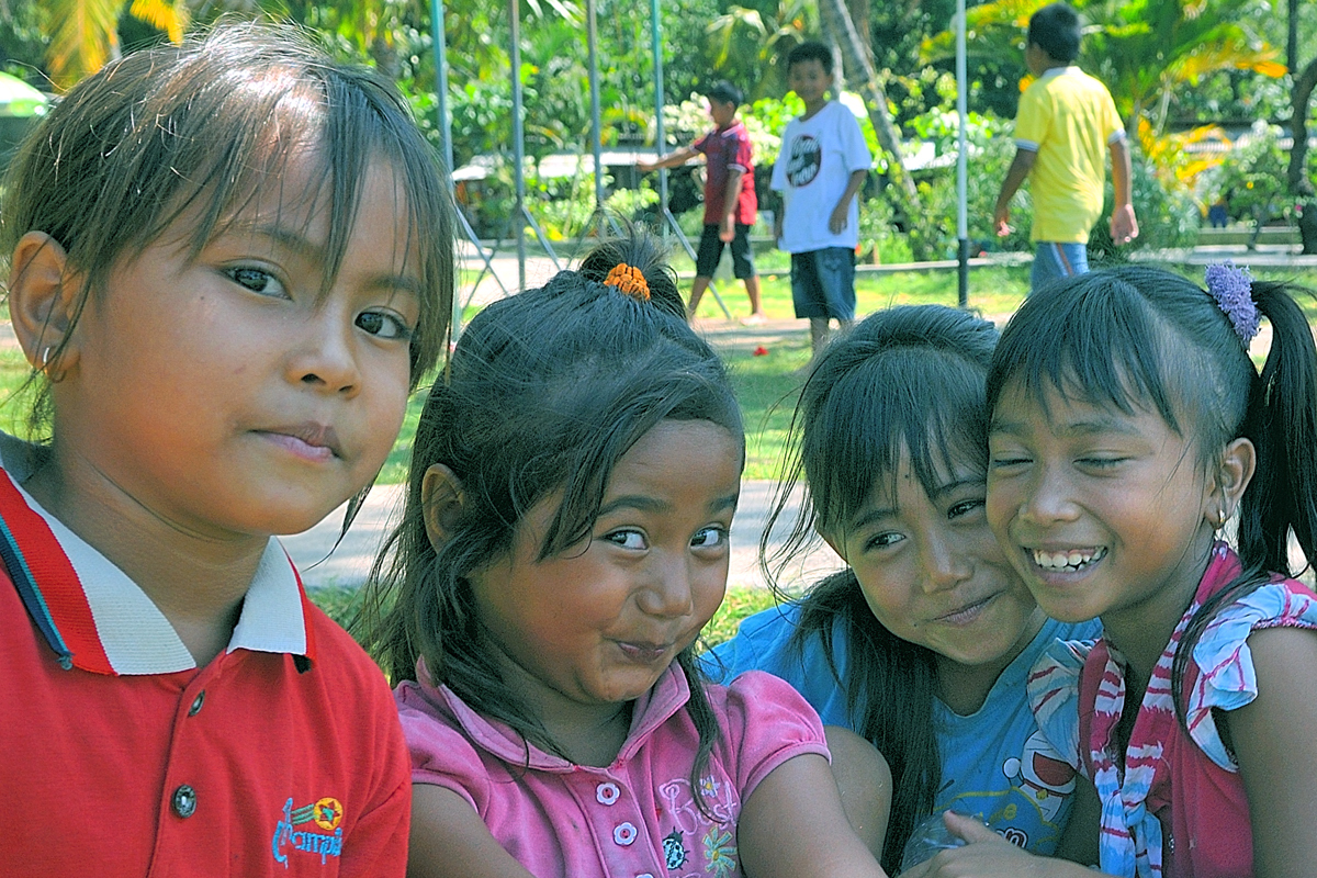 Young Balinese enjoy in Air Sanih