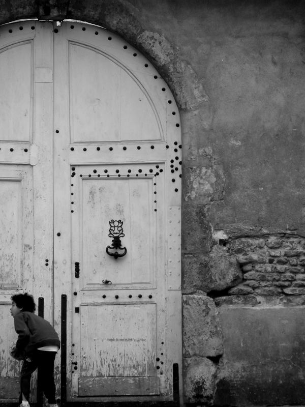 Young boy in the corner of a street