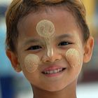 Young ginger boy with his thanaka make up in Rangoon