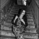 Young lady on the baroque staircase.