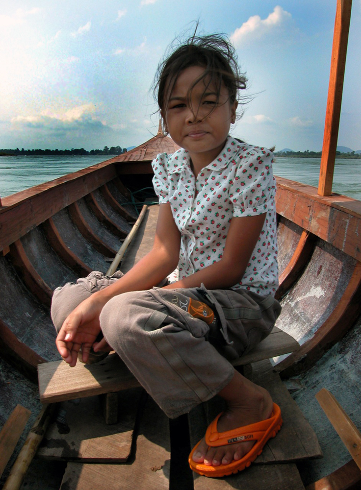 Young Lao girl guides us on the river