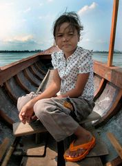 Young Lao girl guides us on the river