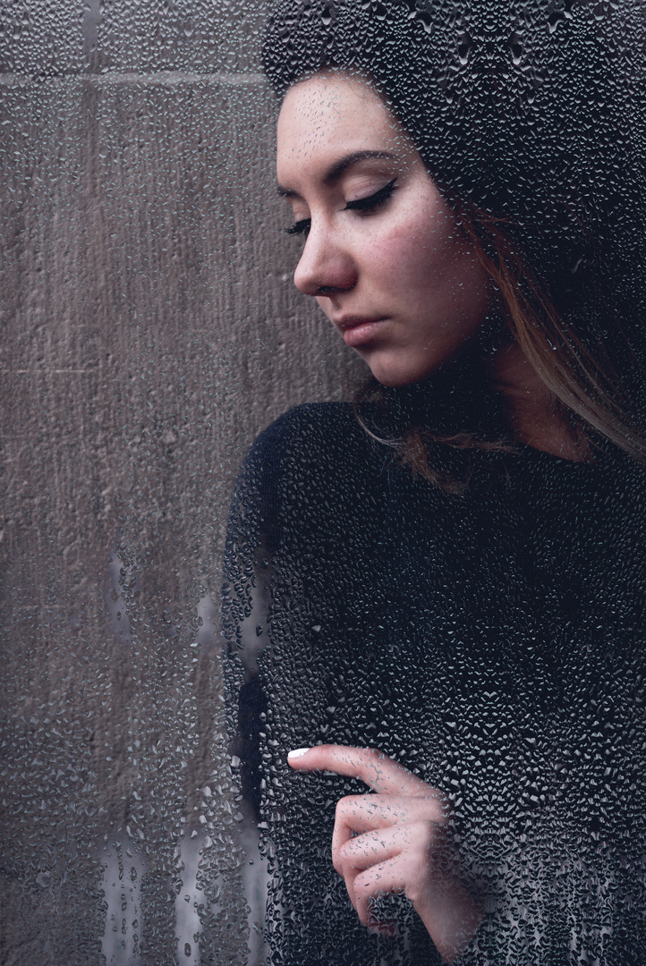 Young moody woman with downcast eyes